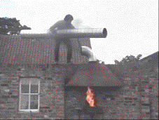 Rex improves the chimney of a lit fire